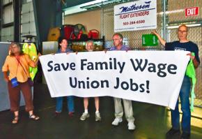 Five protesters send their message inside an air cargo facility in Portland, Ore.